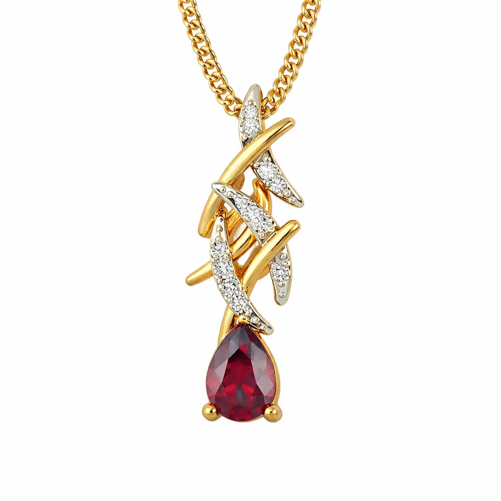 Gold and silver necklace with a red gemstone on a white background