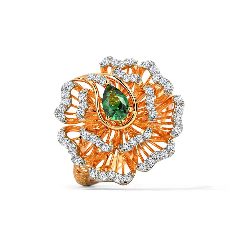 Ornate ring with green gemstone and diamond accents on a white background