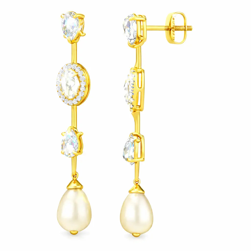 Gold earrings with clear gemstones and a pearl drop on a white background