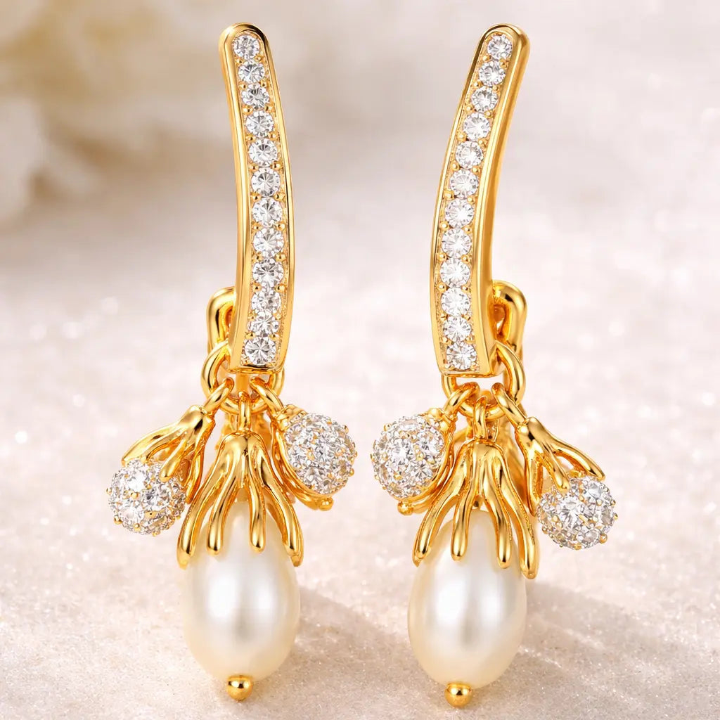 Gold earrings with pearls and diamonds on a soft background
