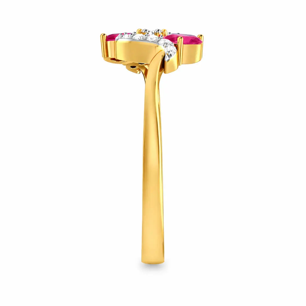 Gold ring with ruby and diamond accents on a white background