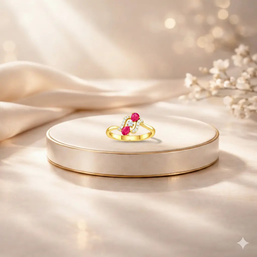 Gold ring with pink gemstones on a white dish against a soft beige background