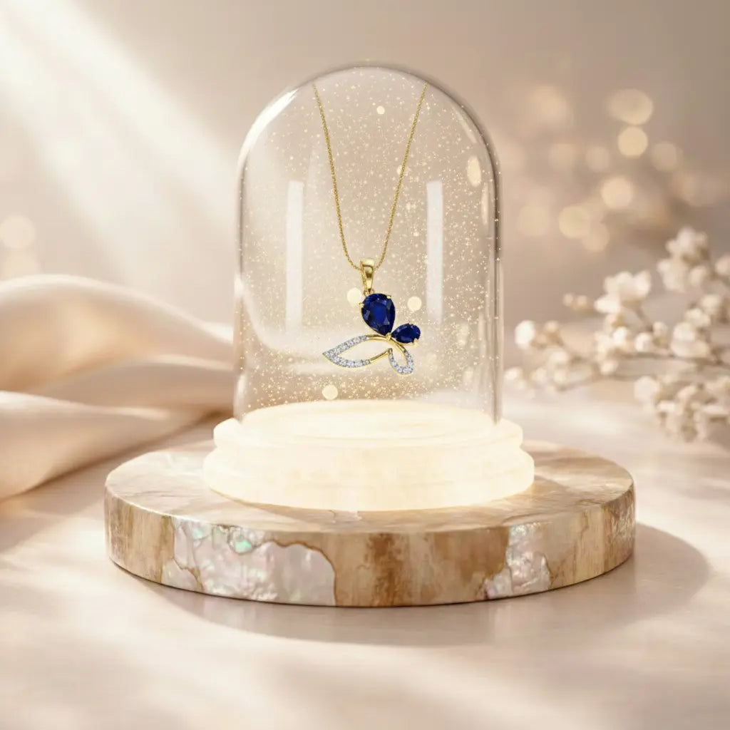 Necklace with a blue pendant under a glass dome on a wooden base