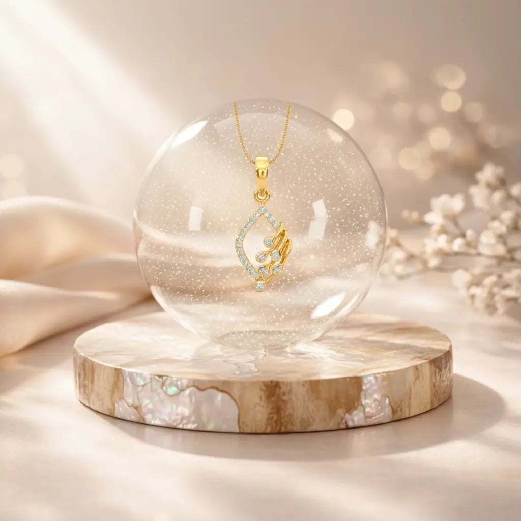Gold necklace with a pendant inside a clear glass sphere on a marble base.