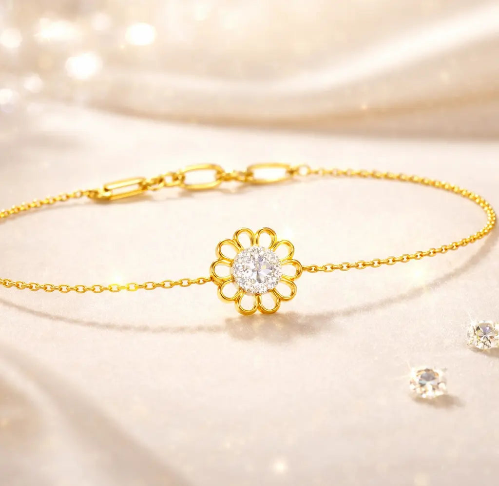Gold bracelet with a floral design on a soft, light background