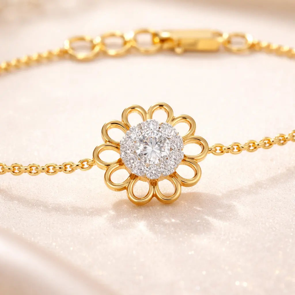 Gold bracelet with a diamond flower clasp on a soft pink background