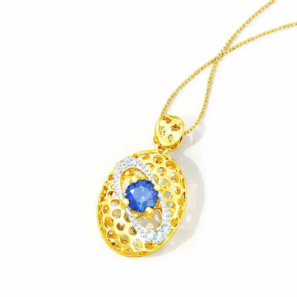 Gold pendant with blue gemstone on a white background