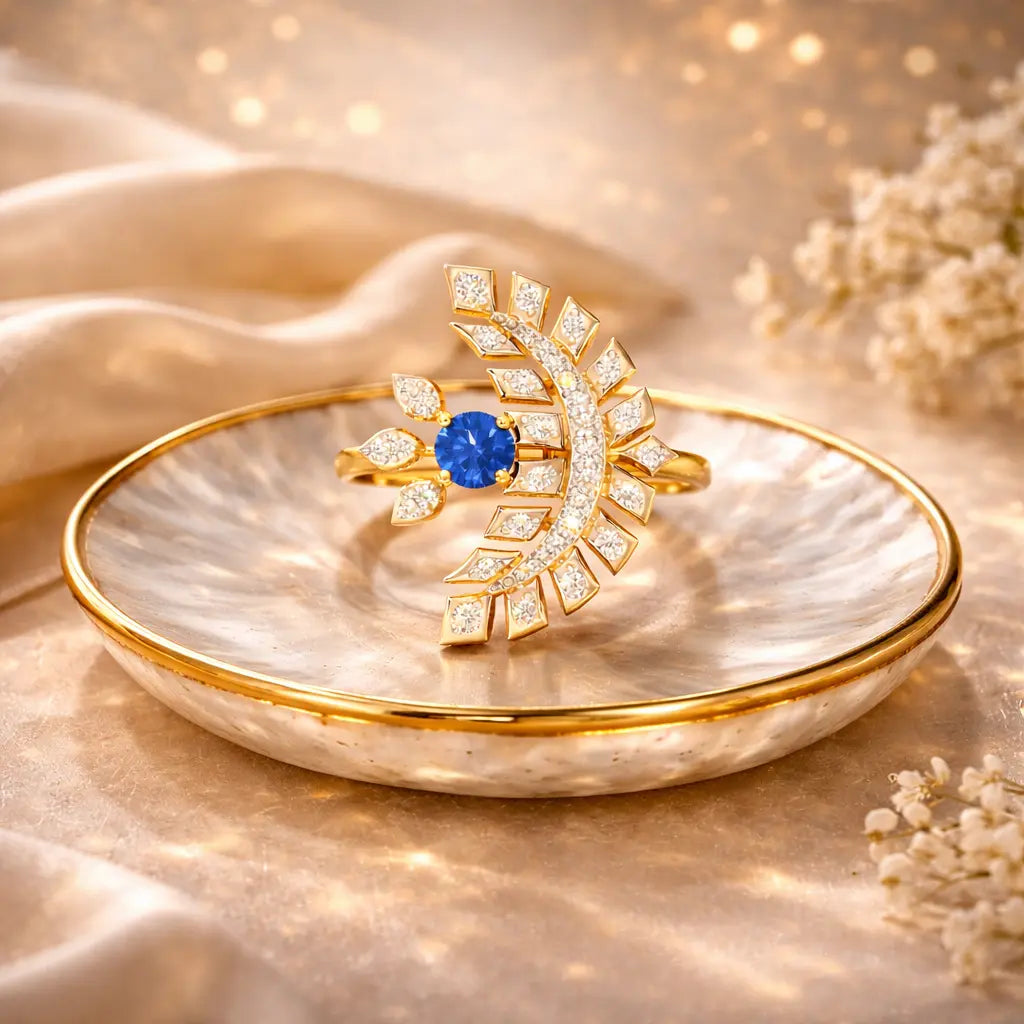 Gold ring with blue gemstone on a decorative dish with a soft, blurred background