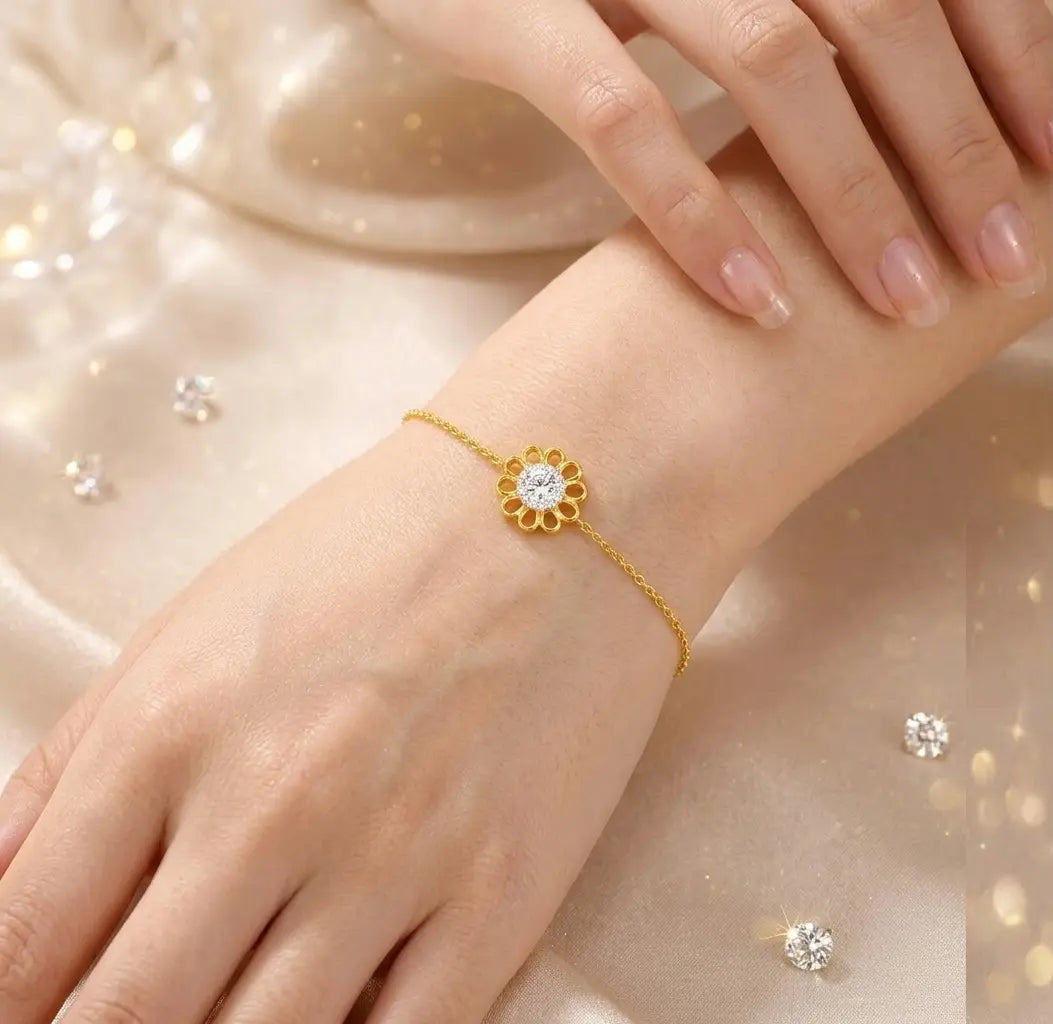 Gold bracelet with a diamond on a wrist against a soft, blurred background