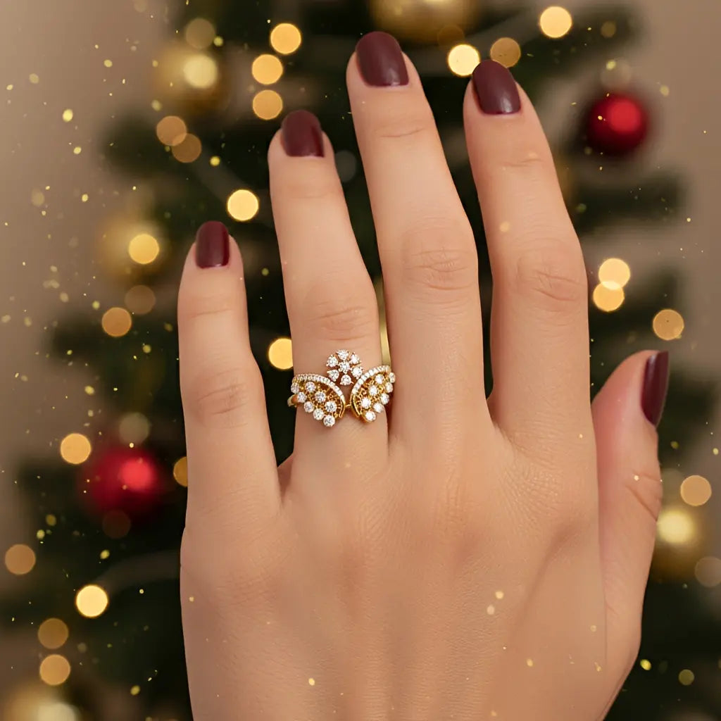 Hand wearing a gold ring with pearls against a festive background