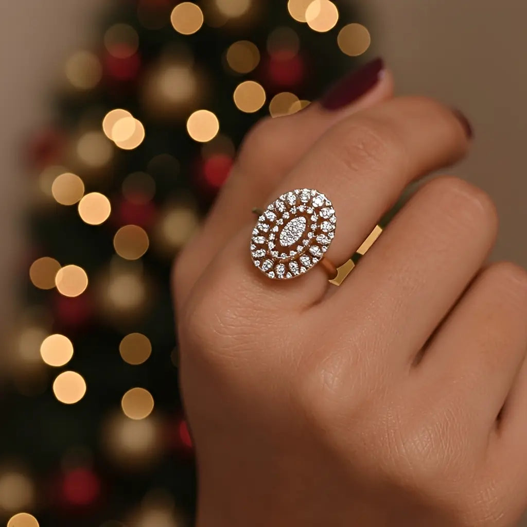 Close-up of a hand wearing a decorative ring with a blurred festive background