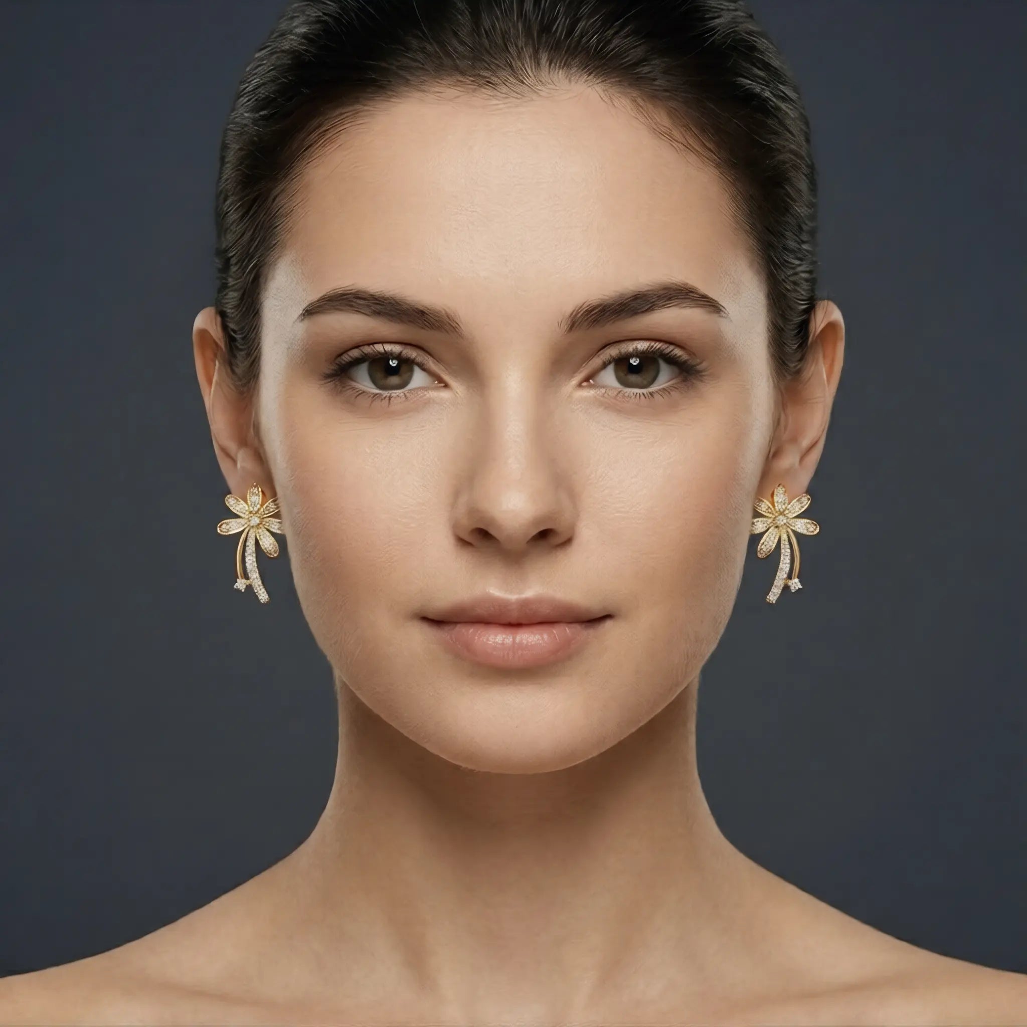Woman wearing gold earrings against a dark background