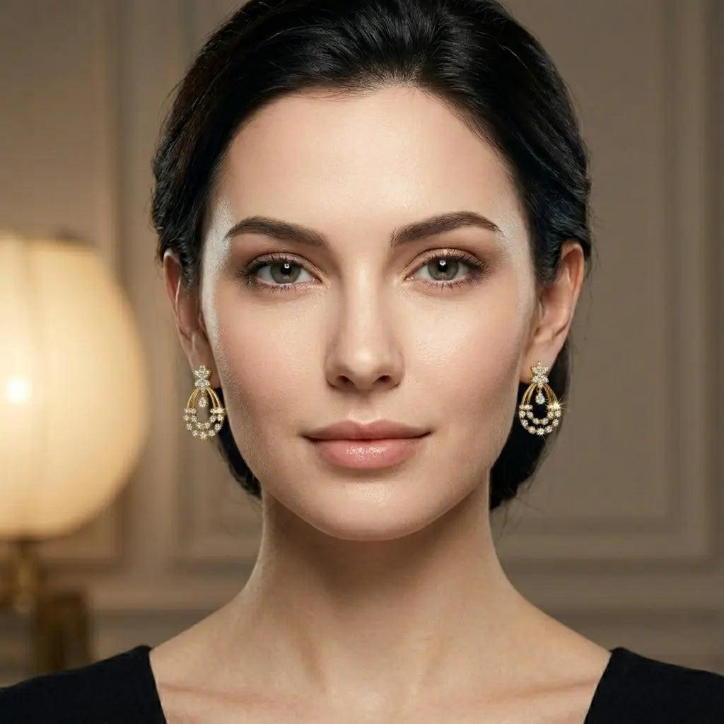 Woman wearing gold earrings with a blurred background